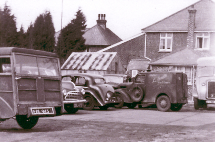 Picture of vehicals at the rear of the Garage in the 1950's